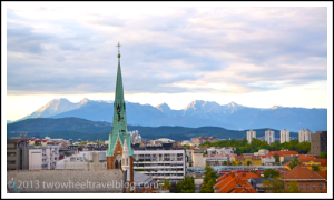 Julian Alps in the skyline of Ljubljana Slovenia; Two Wheel Travel