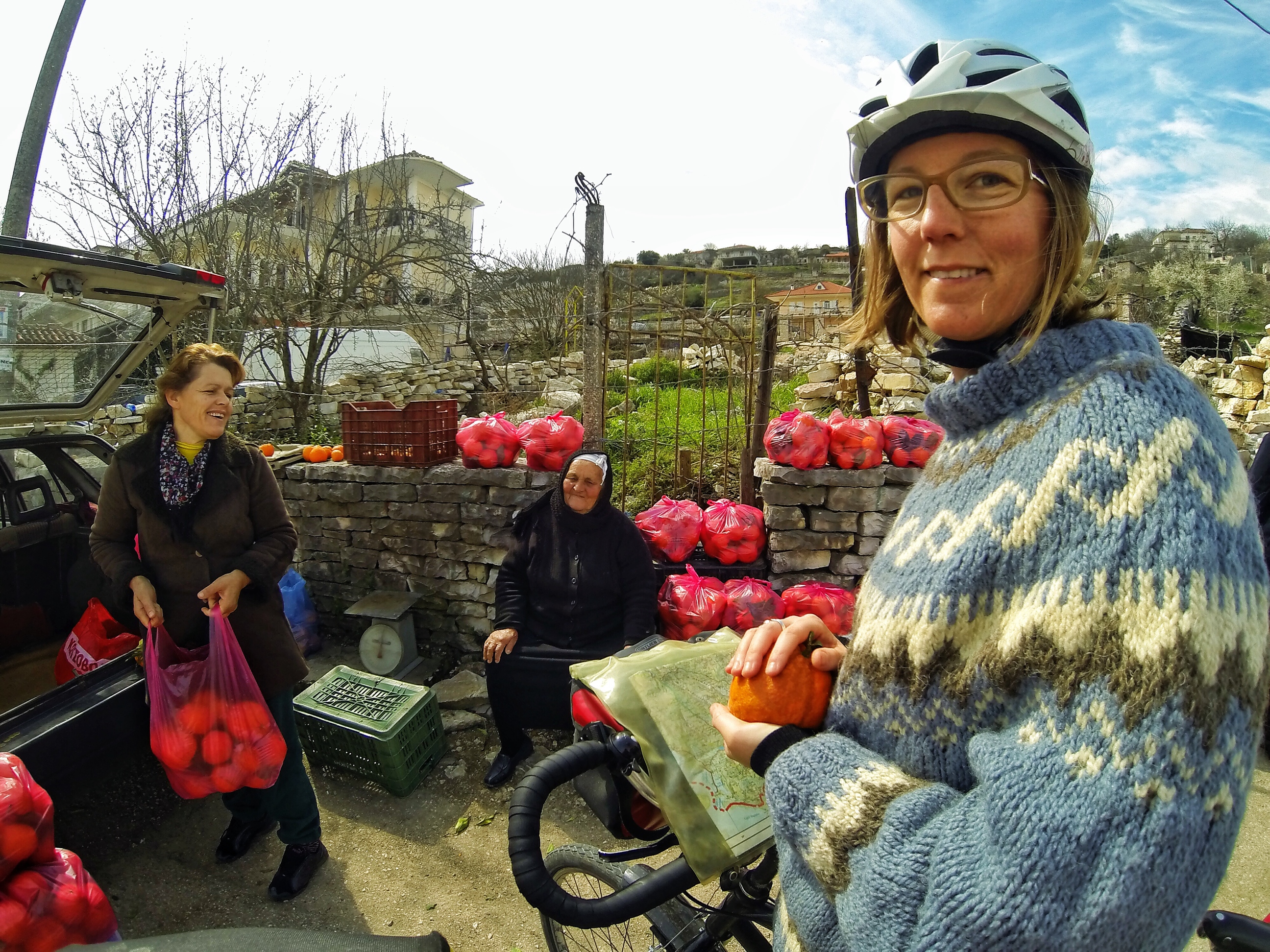 Bicycle Touring Albania. Buying Oranges on the roadside from friendly locals